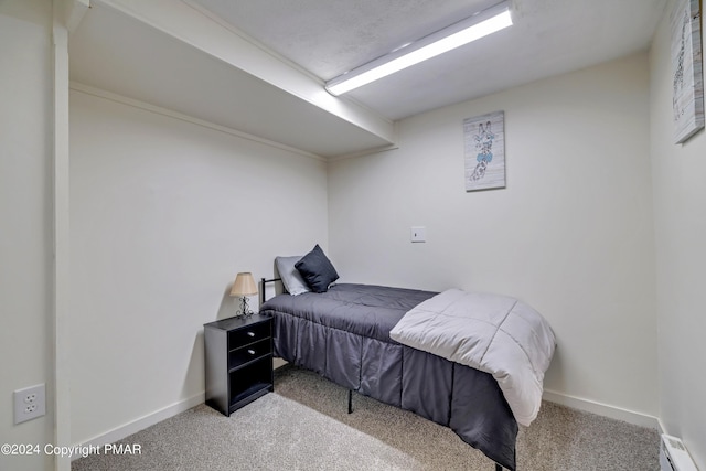 carpeted bedroom with baseboards and baseboard heating