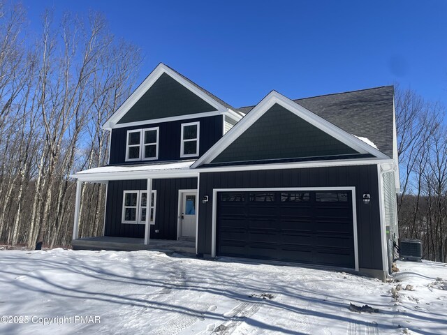 180 Stone Ridge Rd, Albrightsville, PA 18210 - view of front of home featuring a garage, covered porch, central air condition unit, and board and batten siding