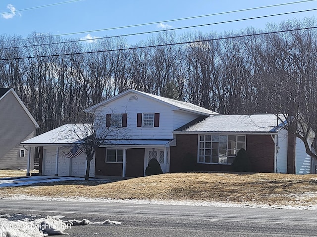 view of front of home featuring driveway and an attached garage