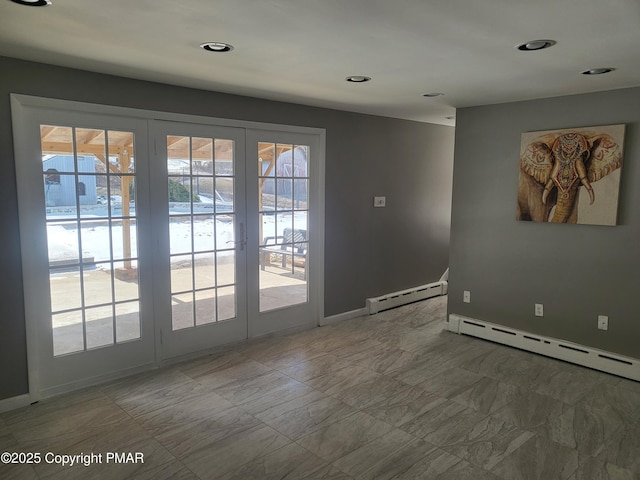 doorway with a healthy amount of sunlight, baseboards, and a baseboard heating unit