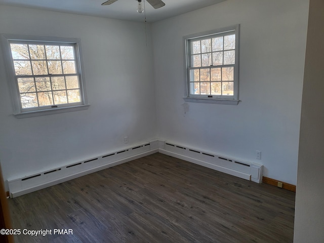 spare room with a baseboard radiator, ceiling fan, baseboards, and wood finished floors