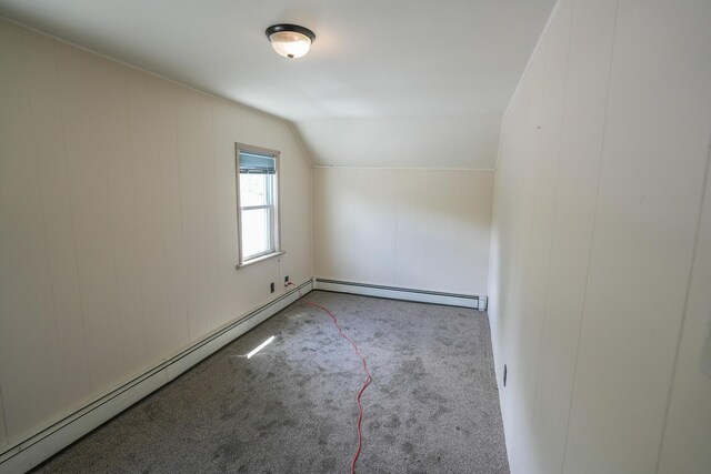 bonus room featuring carpet, a baseboard heating unit, and vaulted ceiling