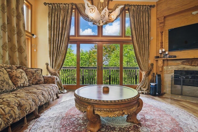 298 Overlook Way, Tannersville, PA 18372 - living area featuring a chandelier, a premium fireplace, and wood finished floors