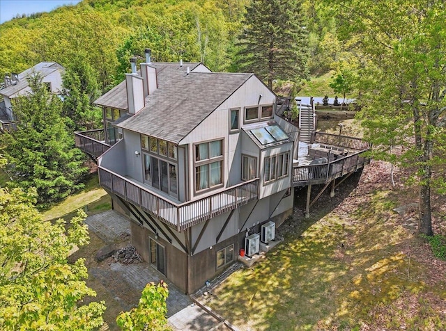 298 Overlook Way, Tannersville, PA 18372 - rear view of house with a forest view, a balcony, a chimney, and roof with shingles