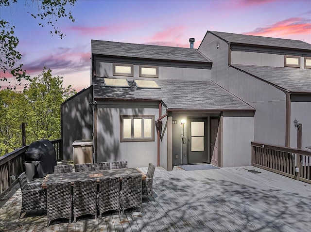 298 Overlook Way, Tannersville, PA 18372 - back of property at dusk featuring a deck and outdoor dining area