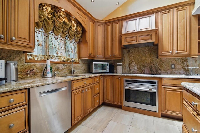 298 Overlook Way, Tannersville, PA 18372 - kitchen featuring stainless steel appliances, a sink, brown cabinets, and vaulted ceiling