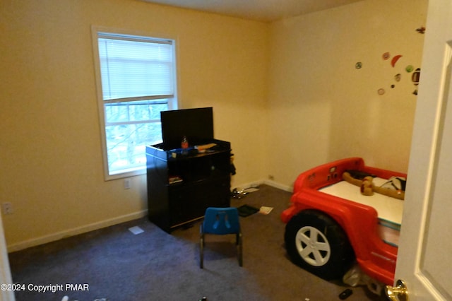 carpeted bedroom with baseboards