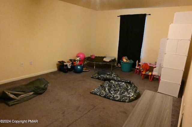 playroom with baseboards and carpet flooring