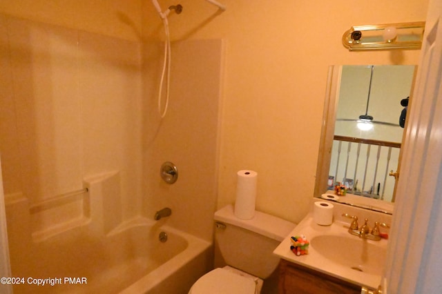 bathroom featuring tub / shower combination, vanity, and toilet