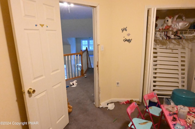 recreation room with carpet flooring and baseboards