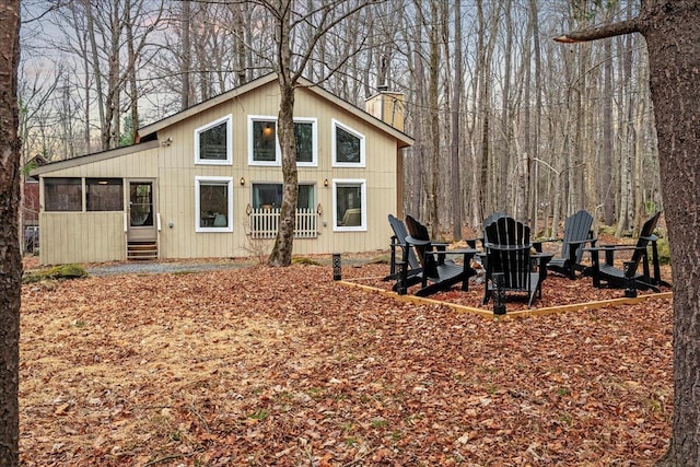 73 Big Bass Dr, Gouldsboro, PA 18424 - back of house with a chimney, entry steps, and a sunroom