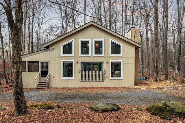 73 Big Bass Dr, Gouldsboro, PA 18424 - rustic home featuring a chimney and entry steps