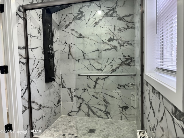 full bathroom with a marble finish shower