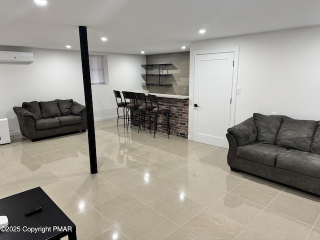 living room with recessed lighting, a wall unit AC, and indoor bar