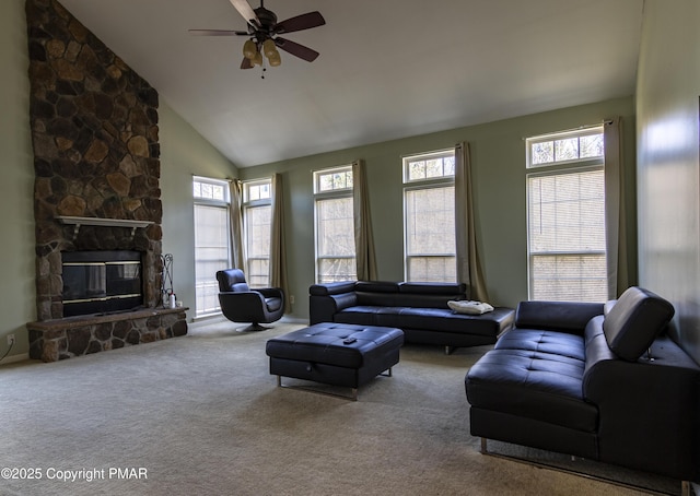 living room featuring plenty of natural light, a fireplace, high vaulted ceiling, and carpet flooring