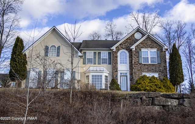 view of front of home with stone siding