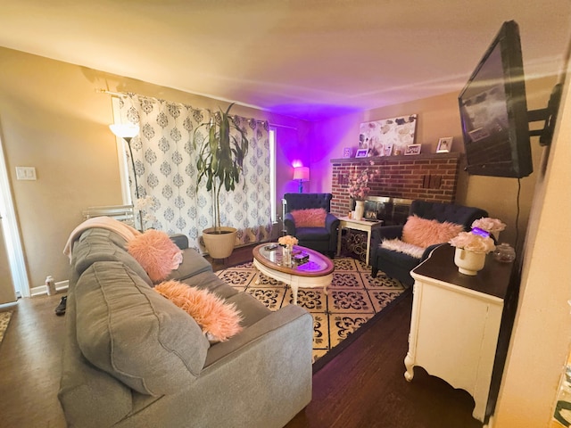 living area featuring baseboards and wood finished floors