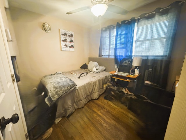 bedroom with wood finished floors and a ceiling fan