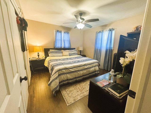 bedroom with dark wood finished floors and ceiling fan