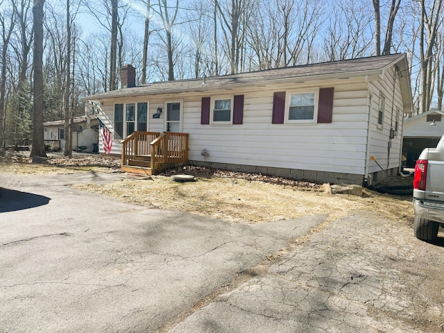 view of front of property featuring a chimney