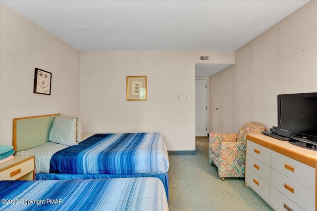 bedroom with light carpet and visible vents