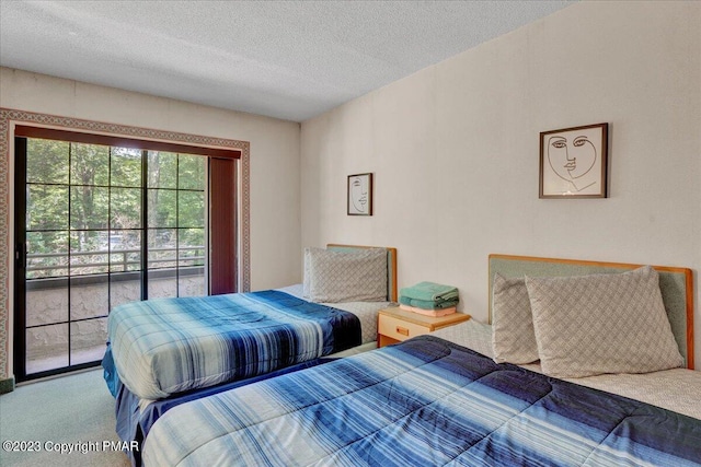 bedroom featuring carpet floors, access to outside, and a textured ceiling