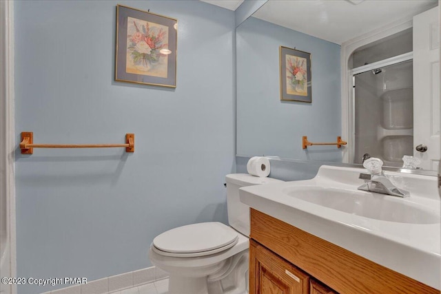 bathroom with tile patterned flooring, a shower with shower door, vanity, and toilet