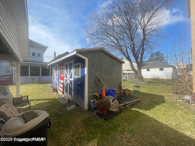 view of shed with fence