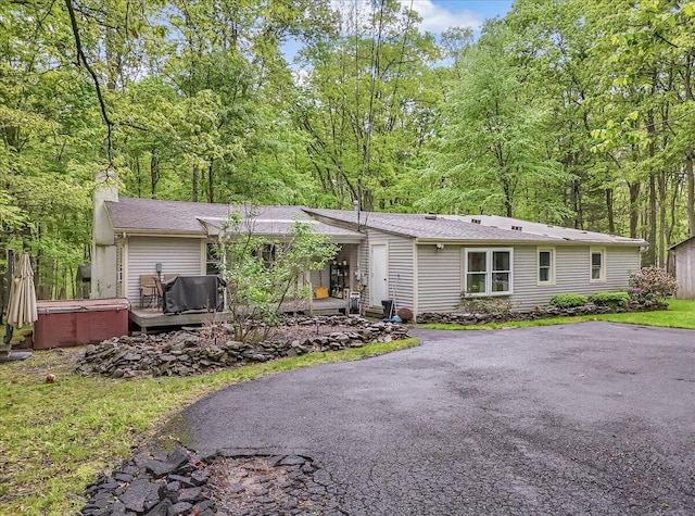 3405 Masons Ln, East Stroudsburg, PA 18302 - single story home with a hot tub, a chimney, and asphalt driveway