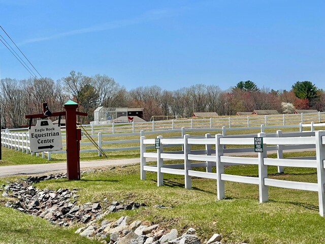 view of yard featuring a rural view and fence