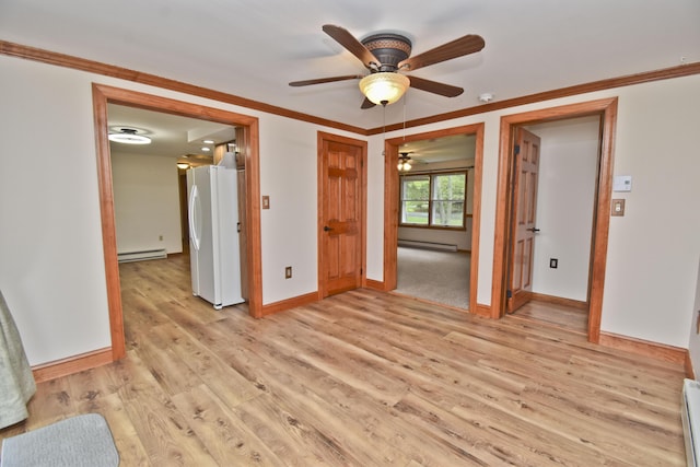 unfurnished room featuring a baseboard radiator, light wood finished floors, ornamental molding, baseboards, and ceiling fan