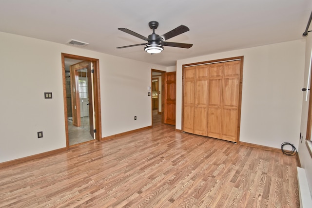 unfurnished bedroom with light wood finished floors, a closet, baseboards, and ceiling fan