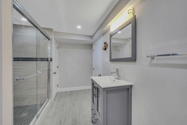 23 Primrose Dr, East Stroudsburg, PA 18302 - full bathroom featuring vanity, wood finished floors, baseboards, recessed lighting, and a shower stall