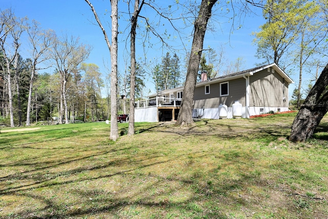 23 Primrose Dr, East Stroudsburg, PA 18302 - rear view of house with a lawn, a deck, and a chimney