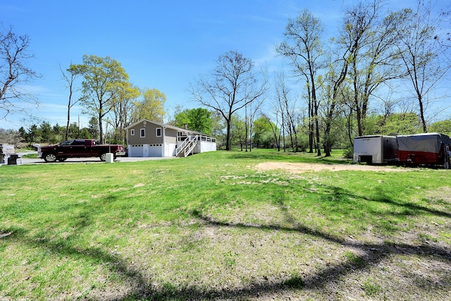 23 Primrose Dr, East Stroudsburg, PA 18302 - view of yard with stairs and an attached garage