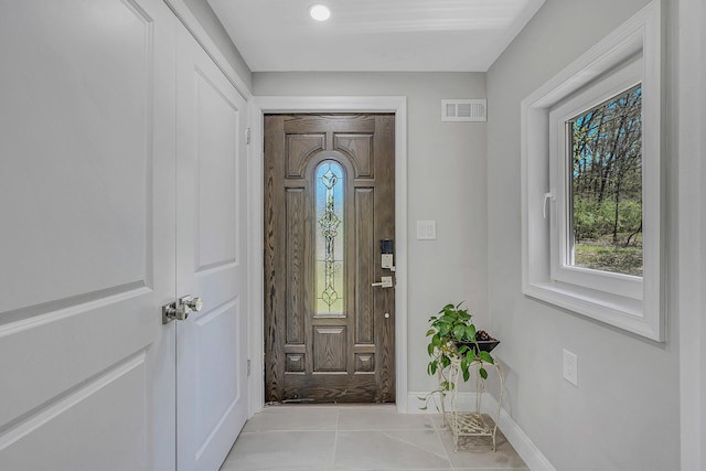 23 Primrose Dr, East Stroudsburg, PA 18302 - foyer entrance with baseboards, plenty of natural light, tile patterned floors, and visible vents