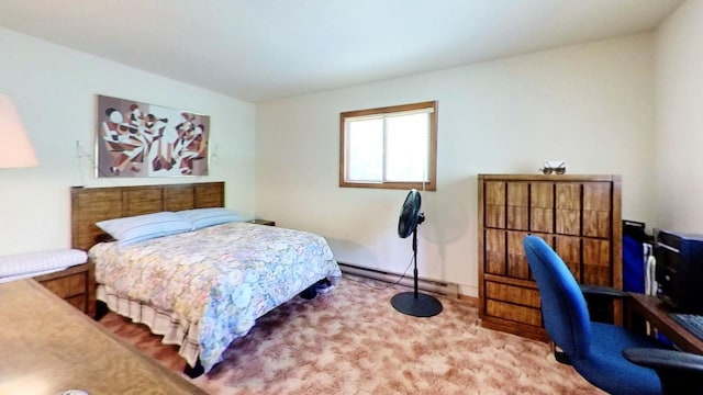 bedroom featuring a baseboard heating unit, a desk, and carpet floors