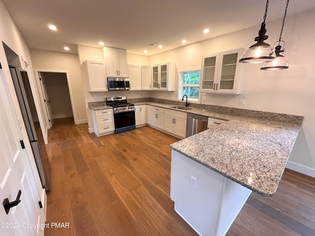 30 Susquehanna Dr, Jim Thorpe, PA 18229 - kitchen featuring appliances with stainless steel finishes, a peninsula, light stone counters, white cabinets, and recessed lighting