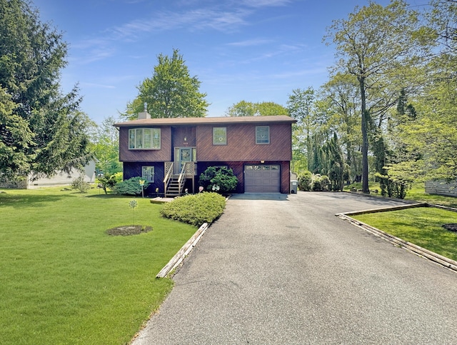 5119 Derby Rd, Tobyhanna, PA 18466 - raised ranch with a garage, driveway, a front lawn, and a chimney