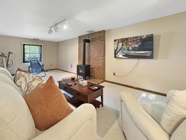 5119 Derby Rd, Tobyhanna, PA 18466 - living room featuring a wood stove, light carpet, and baseboards