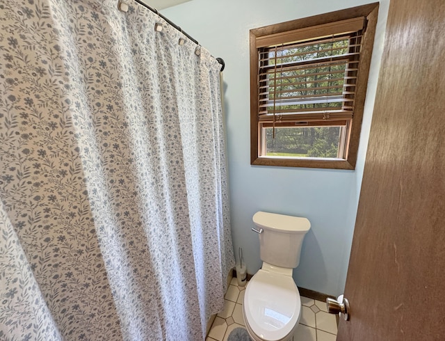 5119 Derby Rd, Tobyhanna, PA 18466 - bathroom with toilet, a shower with shower curtain, tile patterned floors, and baseboards