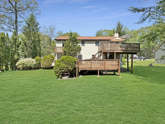 5119 Derby Rd, Tobyhanna, PA 18466 - rear view of house with a wooden deck, a lawn, a chimney, and stairs