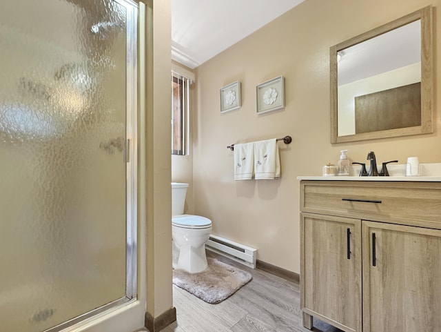 5119 Derby Rd, Tobyhanna, PA 18466 - bathroom featuring a baseboard heating unit, baseboards, toilet, vanity, and wood finished floors