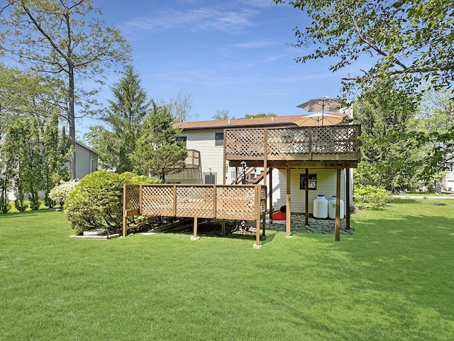 5119 Derby Rd, Tobyhanna, PA 18466 - rear view of house featuring a wooden deck and a lawn