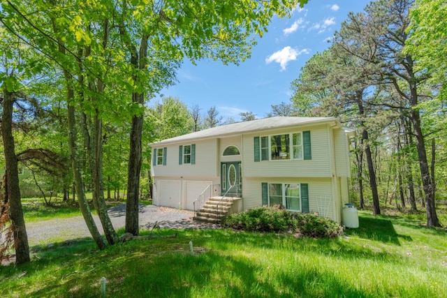 165 Stillwater Dr, Pocono Summit, PA 18346 - raised ranch featuring gravel driveway and an attached garage
