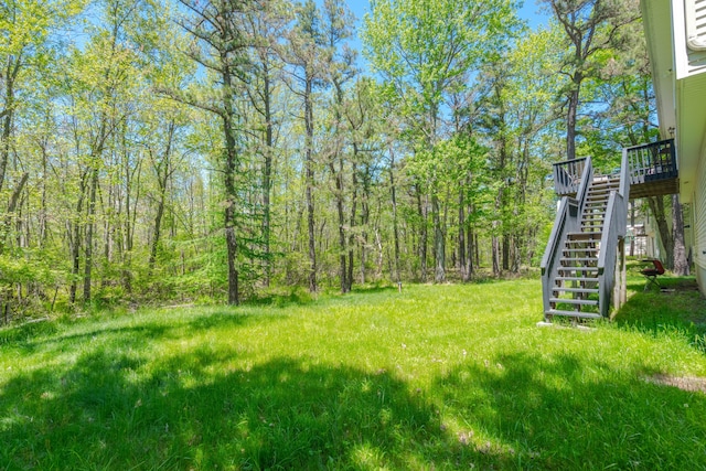 165 Stillwater Dr, Pocono Summit, PA 18346 - view of yard featuring stairway and a wooden deck