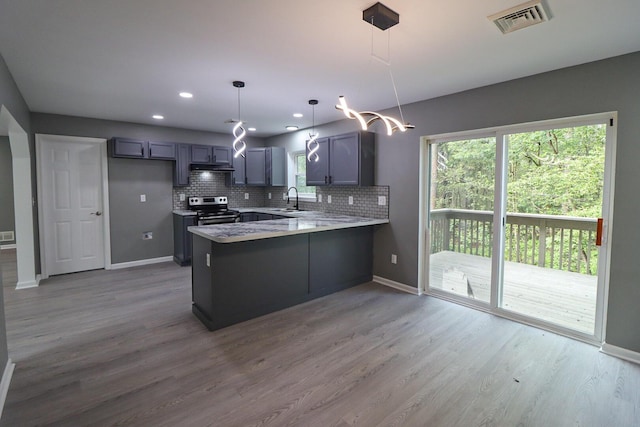 302 Leaf St, Tobyhanna, PA 18466 - kitchen featuring electric stove, a peninsula, wood finished floors, healthy amount of natural light, and recessed lighting