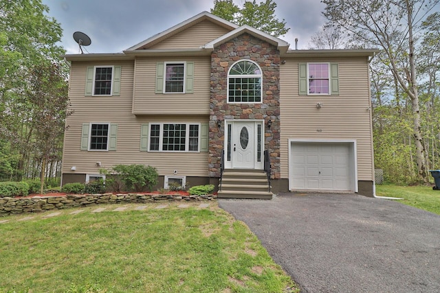 302 Leaf St, Tobyhanna, PA 18466 - view of front of property featuring driveway, an attached garage, a front lawn, and stone siding