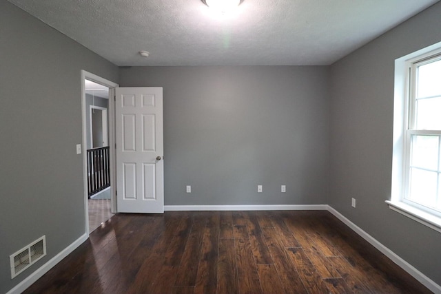 302 Leaf St, Tobyhanna, PA 18466 - unfurnished room featuring dark wood-style floors and a textured ceiling