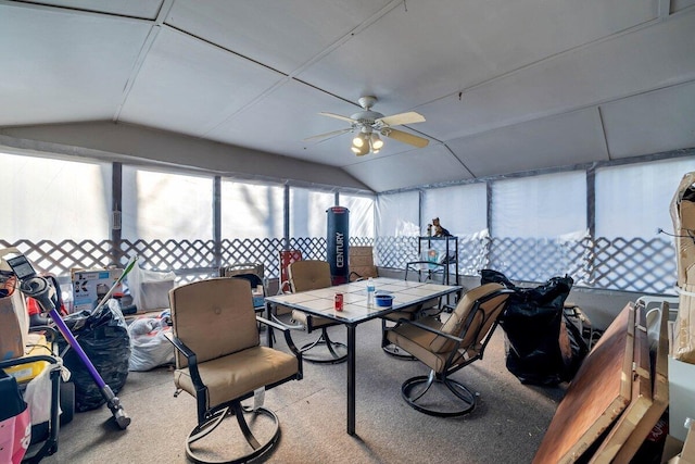 sunroom with ceiling fan and vaulted ceiling